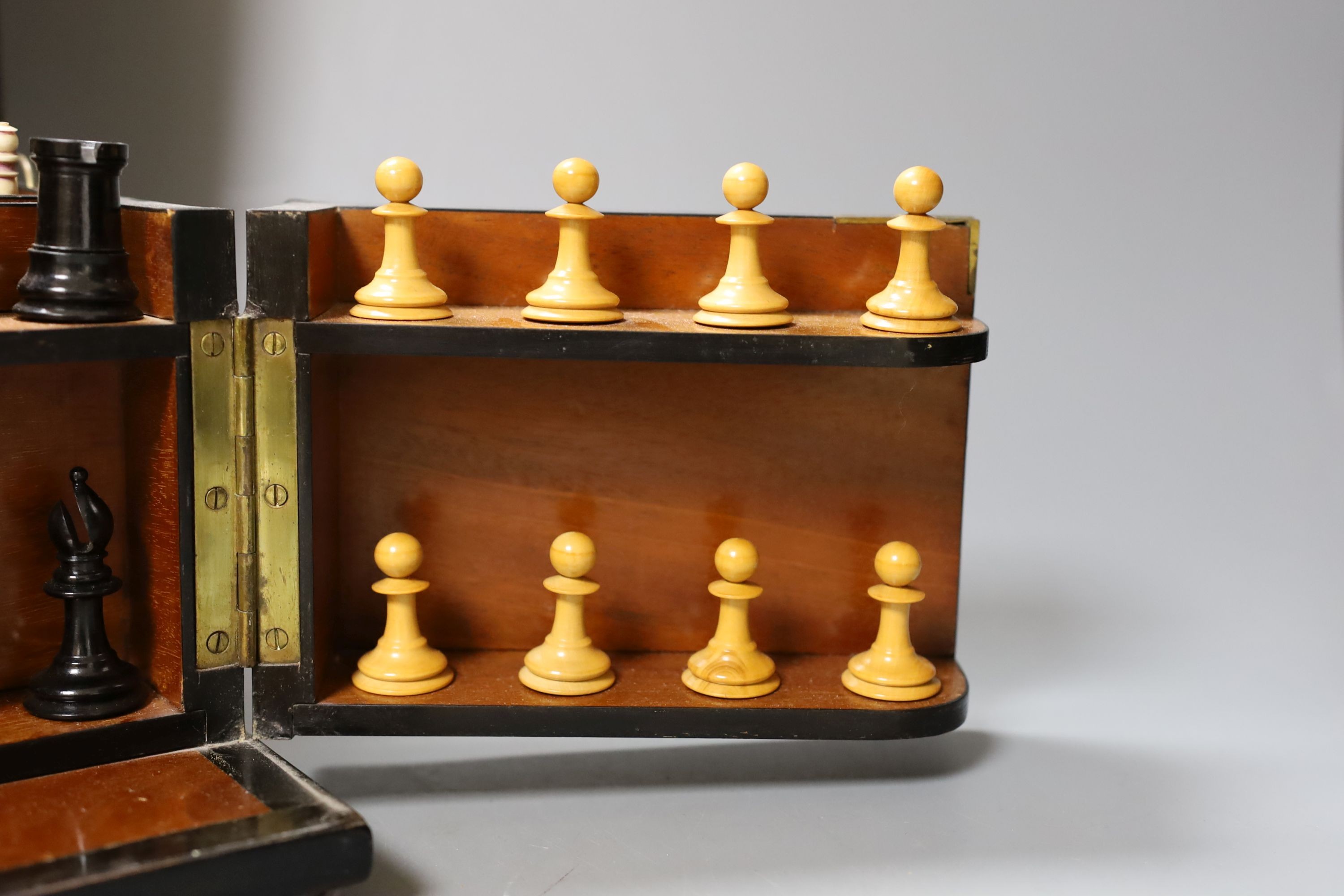 A Victorian walnut games compendium, 33cm wide